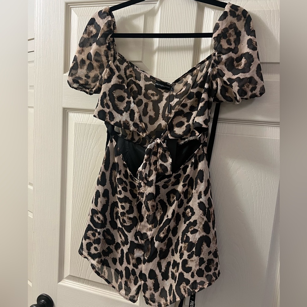 Pretty Little Thing cheetah romper. Never worn. Tags still on.